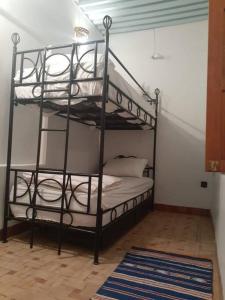 a bedroom with two bunk beds in a room at Entire Private House in Fez Medina! in Fez