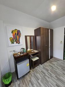 a room with a kitchen with a sink and a counter at Samui Green Hotel in Chaweng