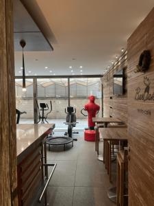 a restaurant with a person standing in the middle of a room at Karl s Single Room with Gym and Bar in Jounieh