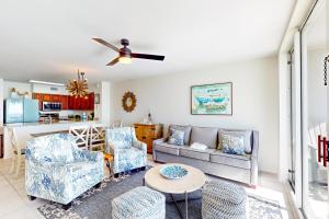 a living room with a couch and chairs and a table at Island Princess 704 in Fort Walton Beach
