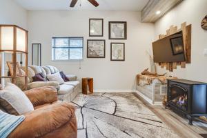 a living room with two couches and a fireplace at Peaceful Ellsworth Vacation Rental with Grill 