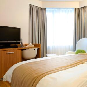 Ένα ή περισσότερα κρεβάτια σε δωμάτιο στο Hotel Simoncini
