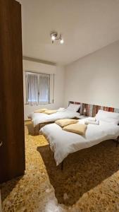 Ένα ή περισσότερα κρεβάτια σε δωμάτιο στο Monticelli apt - 6 posti letto