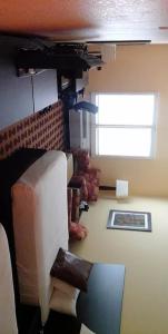 a living room with a couch and a window at Sagebrush Hotel in Crystal City