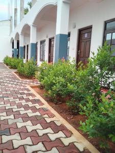a brick walkway in front of a building at Dream Guest House in Trincomalee