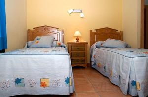 Ένα ή περισσότερα κρεβάτια σε δωμάτιο στο Casa Carrera Rural