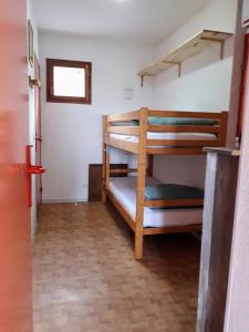 a room with two bunk beds in a room at LA Source Blanche in Saint-Jean
