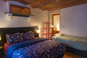 a bedroom with a bed and a red ladder at Heaven in Antwerp in Antwerp