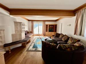 a living room with a couch and a table at 145m2Ferienwohnung Haas in Fügen