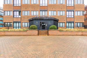 a brick building with a door in front of it at Gorgeous, Modern apartment-fantastic location in Slough