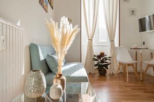 a living room with a couch and a table at Casa Blu Testaccio in Rome