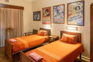 Postel nebo postele na pokoji v ubytování Hotel De Rust
