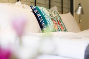 A bed or beds in a room at Magnova Studios