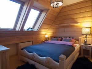 Ein Bett oder Betten in einem Zimmer der Unterkunft Apartamenty Kiry Zakopane