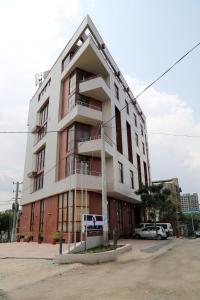 a large white building with a triangle at Ye Afoli International Hotel in Addis Ababa