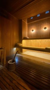 a sauna with a bucket in the middle of it at Garden Park Hotel in San Miguel de Tucumán