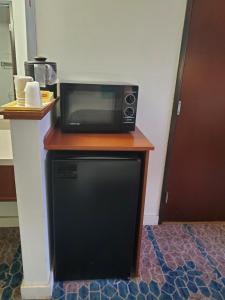 a microwave sitting on top of a table at Omak Inn in Omak