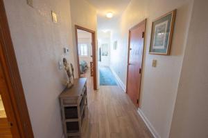 a hallway of a home with a room with a hallway at Your Beachfront Resort Oasis in Myrtle Beach