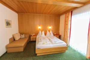 Krevet ili kreveti u jedinici u okviru objekta Alpenhotel Tauernstüberl