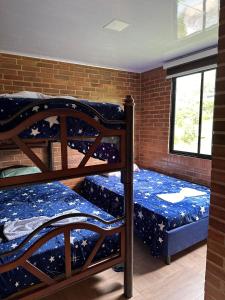 Katil atau katil-katil dalam bilik di Eco Hotel La Primavera - Cabañas Campestres de Descanso