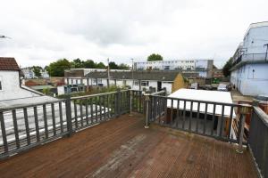 a balcony with a view of a city at New 2 bed home with off-road parking sleeps 6 in Brockhurst