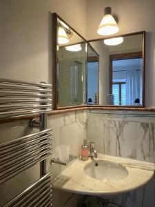 a bathroom with a sink and a mirror at Martina a Piazza del Popolo in Rome
