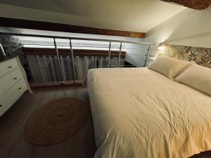 a bedroom with a large bed and a window at Love & Spa Fréjus in Fréjus +17 photos