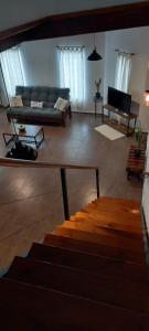 a living room with a couch and a table at El Bagual de Monte XL in San Miguel del Monte +36 photos