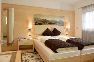 A bed or beds in a room at B&B Appartments Cudlea