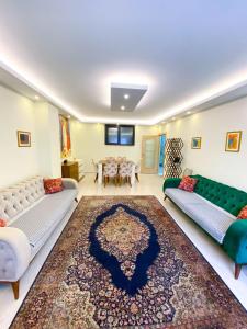 a living room with two couches and a table at Ottoman life flat in Istanbul