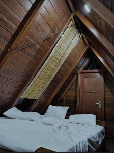 a bedroom with two beds in a attic at Sky View Cabin Unawatuna in Unawatuna