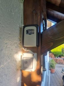 a door with a meter on the side of a house at Ferienwohnung Gabi in Eigeltingen