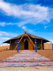 a tent in the middle of the desert at Pueblo Touareg - Private Tents in Merzouga