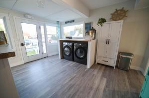 a laundry room with a washer and dryer at Historic Oneida Lakefront 2BR 1BA Condo 4 in Blossvale