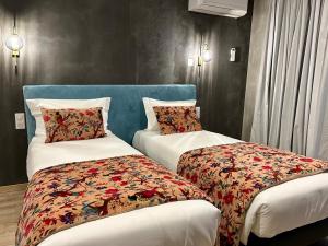 Postel nebo postele na pokoji v ubytování Hôtel Casa Matteu