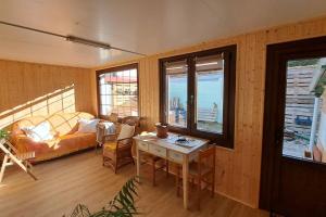 a living room with a table and a couch at Casa Boulogne in Sabiñánigo