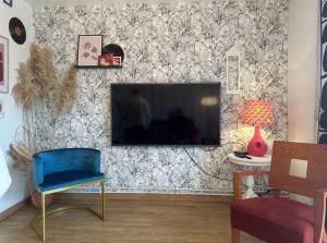 TV i/ili multimedijalni sistem u objektu Charmante maison 10 mn Center Parcs Ailette