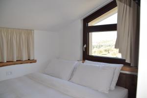 Postel nebo postele na pokoji v ubytování b&b Adamà