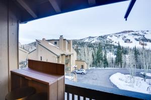 a balcony with a view of a snow covered mountain at Mountain-View Condo in Brian Head with Private Sauna in Brian Head