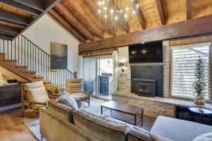 a living room with a couch and a fireplace at Mountain-View Condo in Brian Head with Private Sauna in Brian Head