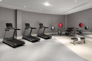 a fitness room with treadmills and exercise bikes at Courtyard by Marriott Chicago at Medical District-UIC in Chicago