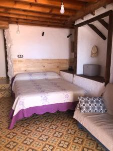 En eller flere senge i et værelse på Finca el Fuenton