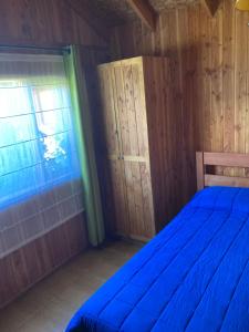 Postel nebo postele na pokoji v ubytování Los arrayanes de huife