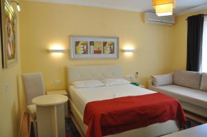 Postel nebo postele na pokoji v ubytování Hotel Pik Loti