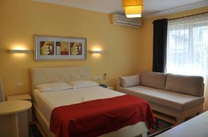Postel nebo postele na pokoji v ubytování Hotel Pik Loti