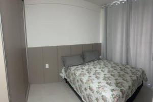 En eller flere senge i et værelse på Apartamento Ponta Verde. Edf. Promenade II