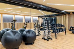 a gym with exercise balls and exercise balls at Hotel Sonne St. Moritz 3* Superior in St. Moritz