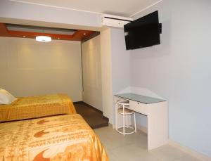 A television and/or entertainment centre at Hotel Gran Sipan