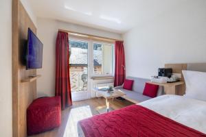 Postel nebo postele na pokoji v ubytování Hotel Sonne St. Moritz 3* Superior