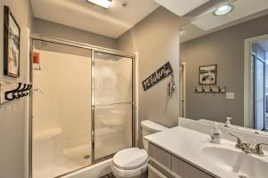 a bathroom with a shower and a toilet and a sink at Anglers Pointe in Branson